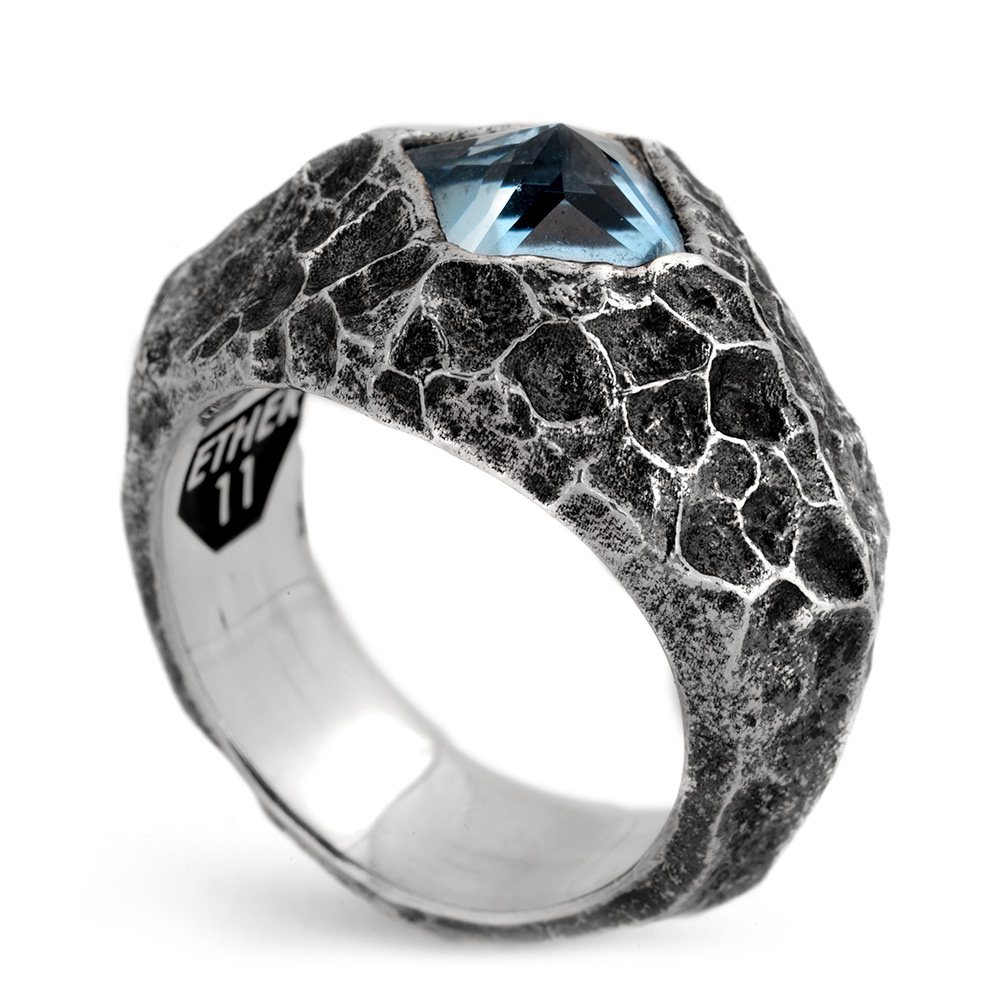 Formation Signet Ring — hero The Formation Signet Ring in oxidized sterling silver with a cracked stone texture, set with a step-cut aquamarine, handmade in Los Angeles by Ether Eleven.