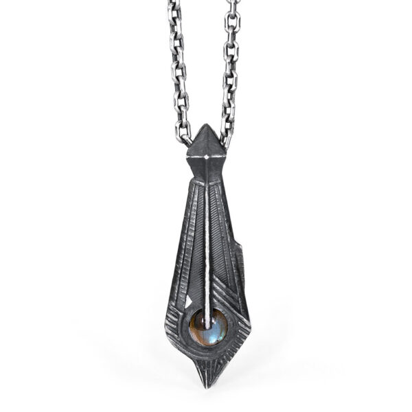 The Memory Pendant in oxidized sterling silver, an art deco spearhead form set with a labradorite cabochon, by Ether Eleven.